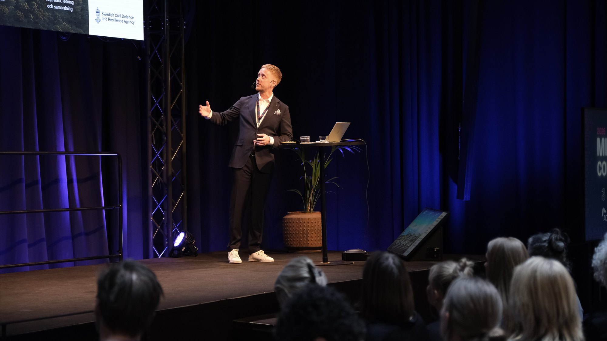Conference speaker on stage at Midnight Sun 2026